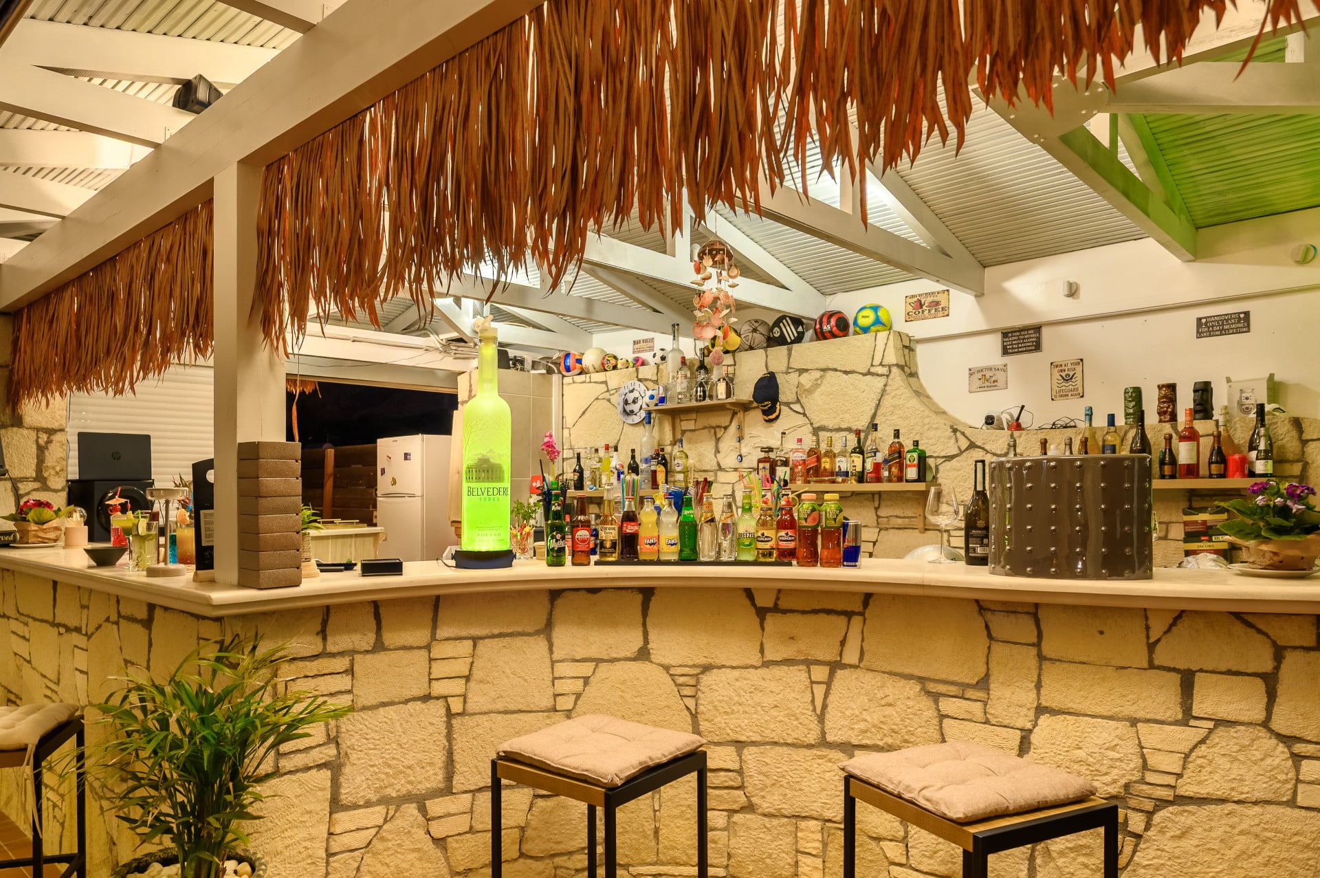 Bar shelves and premium spirits at TE.BRA Hersonissos