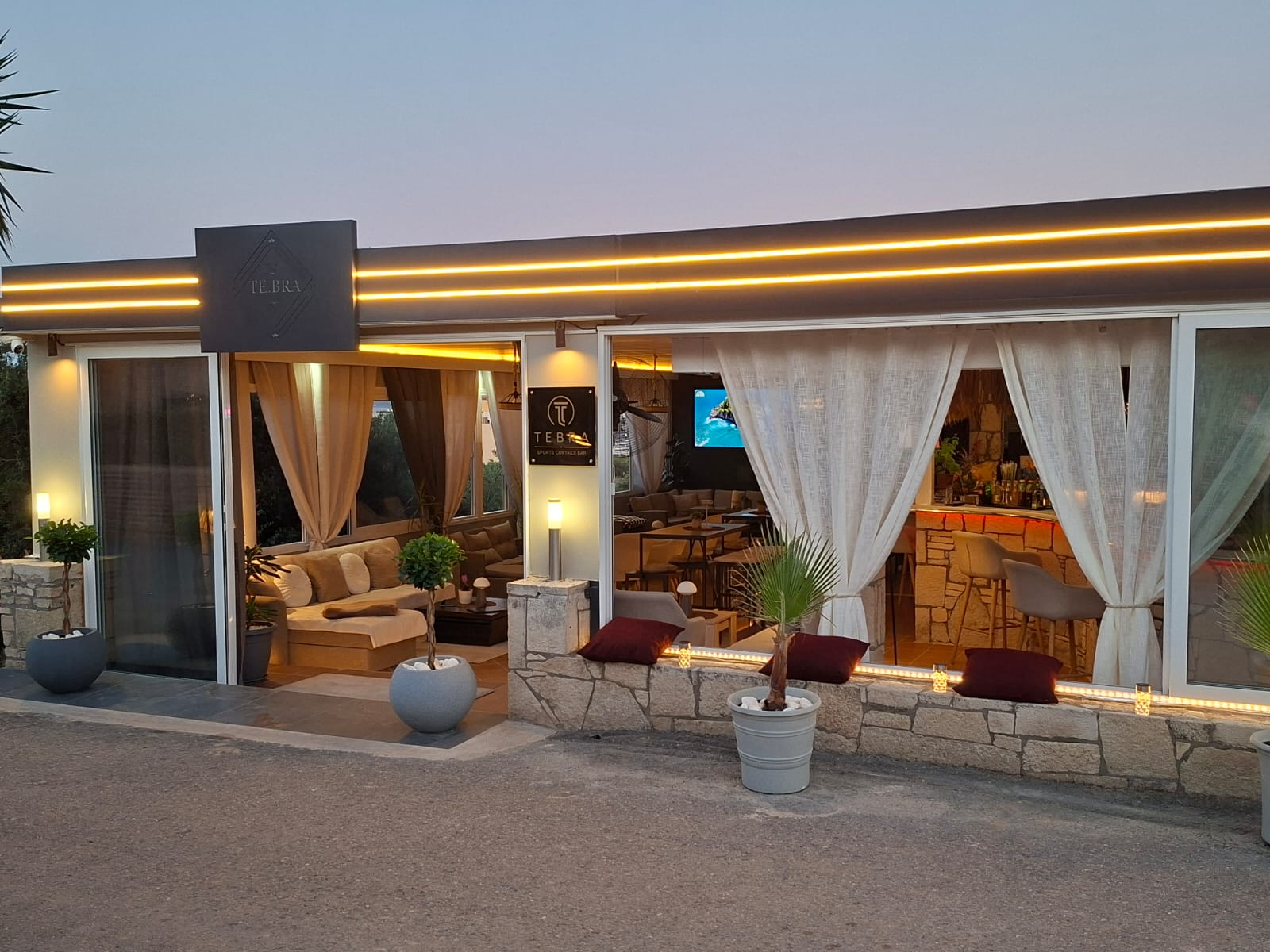 TE.BRA Sports Bar exterior at dusk in Hersonissos Crete
